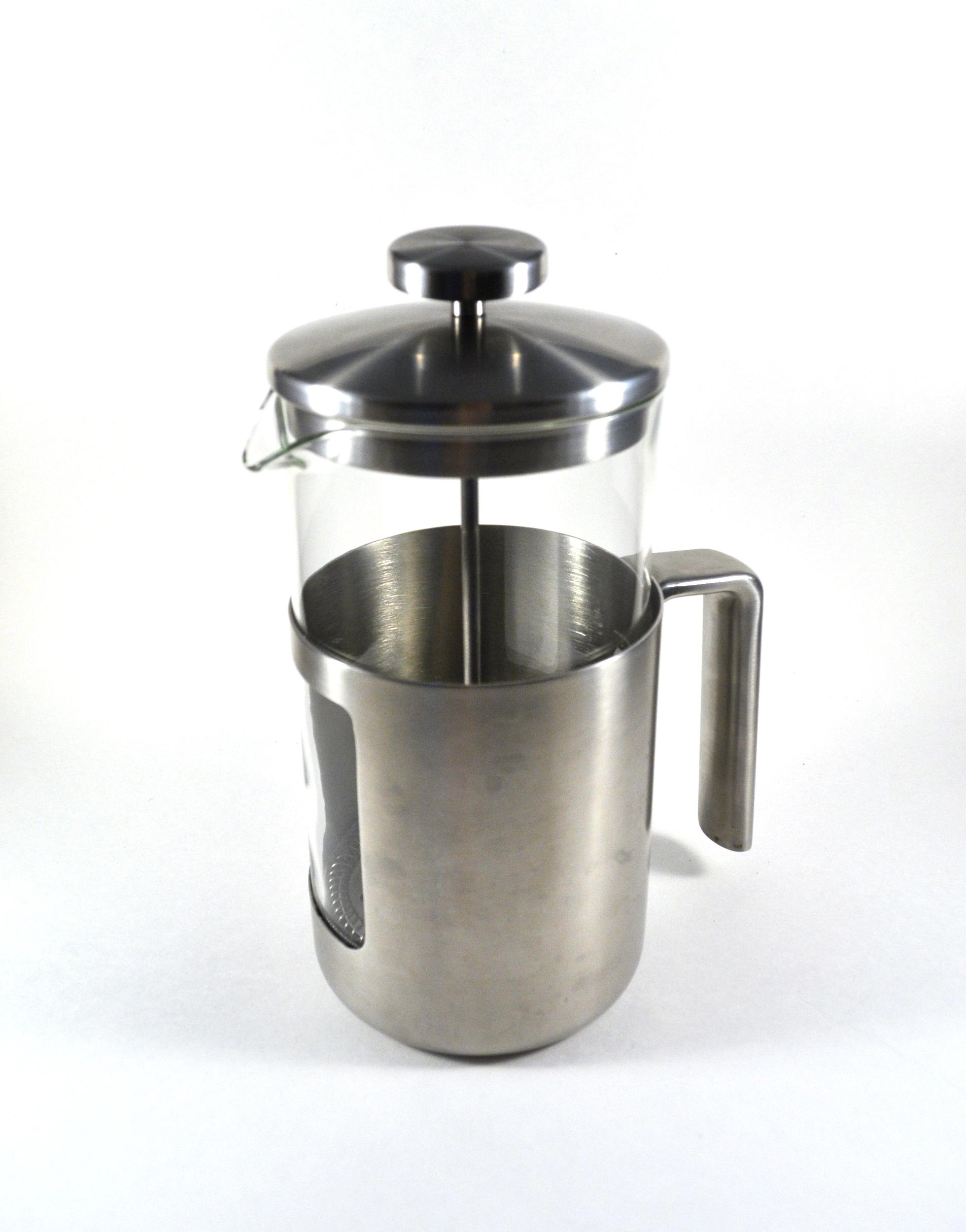 A French press with a glass vessel, metal frame, handle and plunger.